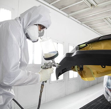 Collision Center Technician Painting a Vehicle | Preston Toyota in Easton MD